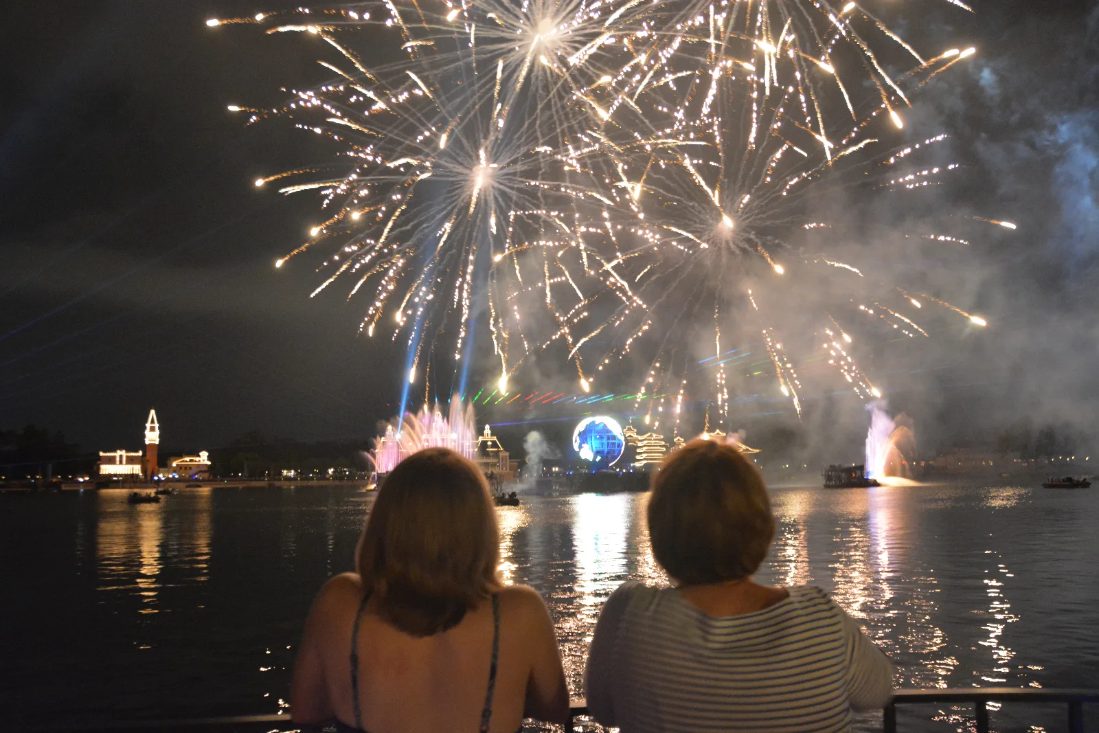 Two generations watching fireworks at Walt Disney World.